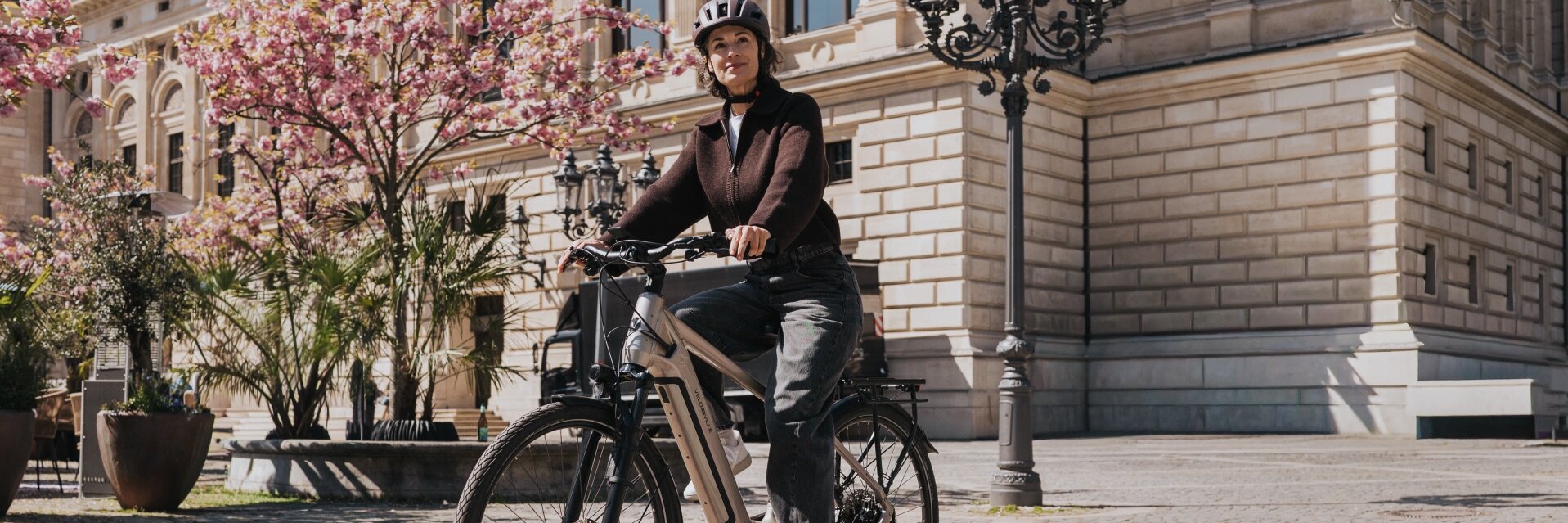 Urban Bosch e-bike rider using walk assist in a city setting